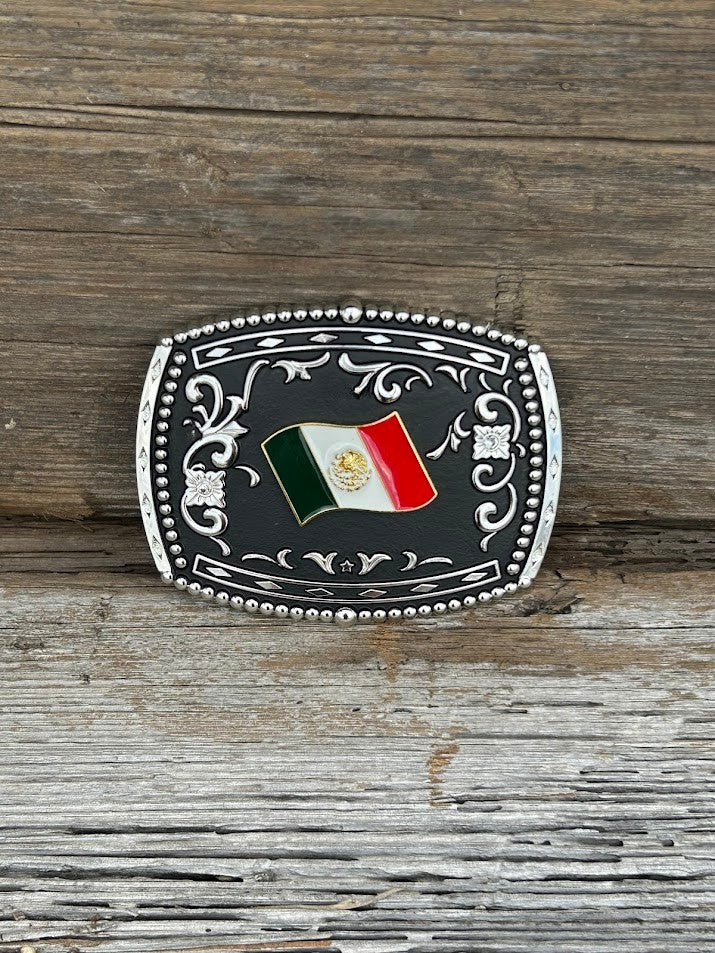This matte black buckle features a Mexico Flag design with a intricate Silver border. Front View