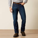 Men's Ariat FR M4 relaxed boot cut jeans in a dark wash. Front View