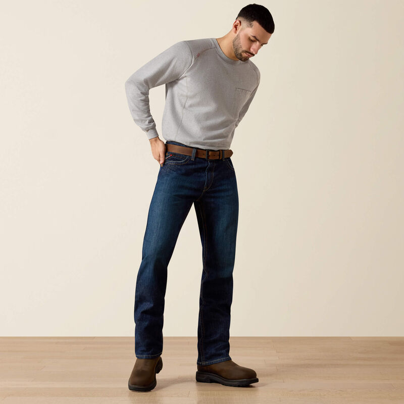 Men's Ariat FR M4 relaxed boot cut jeans in a dark wash. Full front view