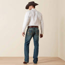 Men's Ariat M5 slim fit straight leg jean in a medium wash. Rear view
