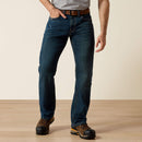 Men's Ariat M4 Rebar relaxed fit boot cut work jeans in a dark wash.  Front View