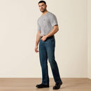 Men's Ariat M4 Rebar relaxed fit boot cut work jeans in a dark wash. Full front view