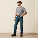 Men's Ariat Rebar M4 relaxed fit boot cut work jeans in a medium wash. Full front view