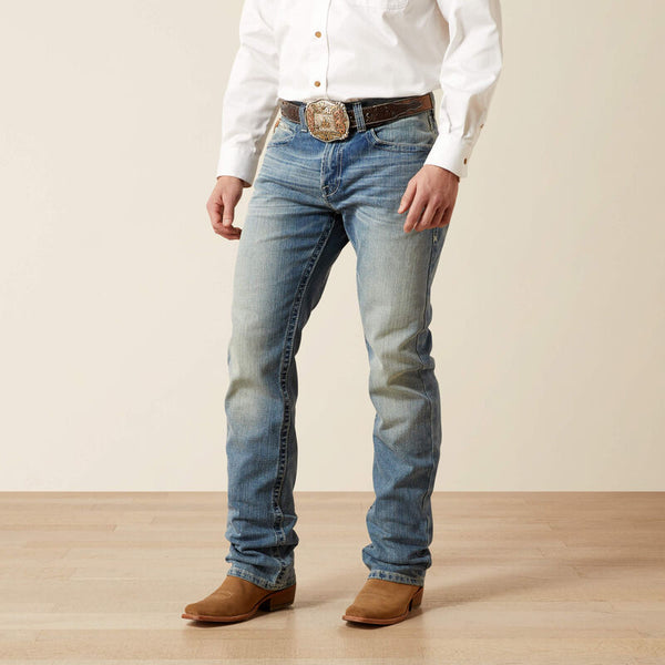 Men's Ariat M4 relaxed fit boot cut jean in a light wash. Front View
