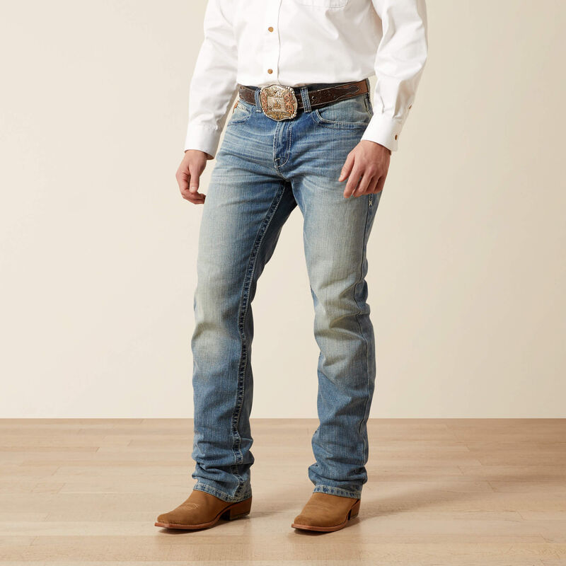 Men's Ariat M4 relaxed fit boot cut jean in a light wash. Front View