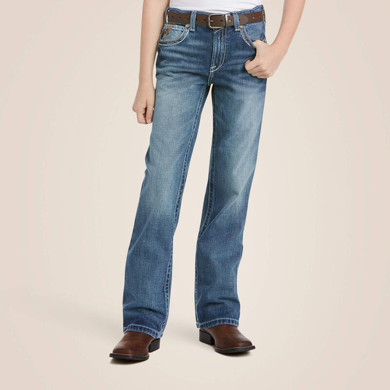 Boys Ariat B4 relaxed fit boot cut jeans in a medium wash. Font view