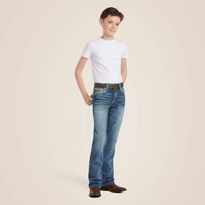 Boys Ariat B4 relaxed fit boot cut jeans in a medium wash. Full front view