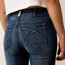 Women's Ariat perfect rise boot cut jeans in a dark wash. Close up rear view showing stitch pattern on pockets. 