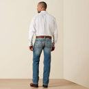 Men's Ariat M7 slim fit straight leg jeans in a light wash. Rear View