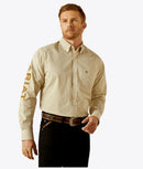 Men's Ariat long sleeve shirt in a Cream/Light Brown pattern. Shirt features button close and a bold Ariat logo on left sleeve. 