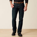 Men's Ariat Rebar M7 slim straight work jeans, in Blackstone a dark wash. Front view showing jeans on a model. 
