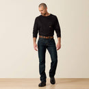 Men's Ariat Rebar M7 slim straight work jeans, in Blackstone a dark wash. Full front view showing jeans on a model. 