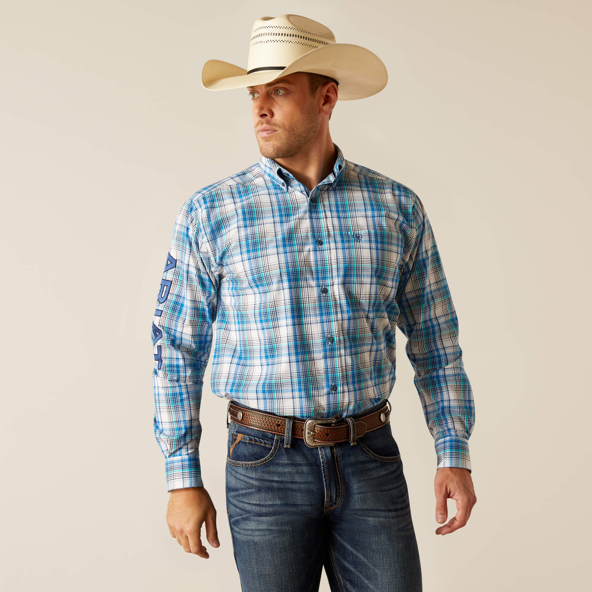 Men's Ariat long sleeve Pro Series Team logo shirt in White/Blue Plaid. Front view showing shirt tucked in. 
