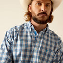 Men's Ariat long sleeve shirt in Blue Plaid. Close up of front showing button down collar and stitched Ariat shield logo. 