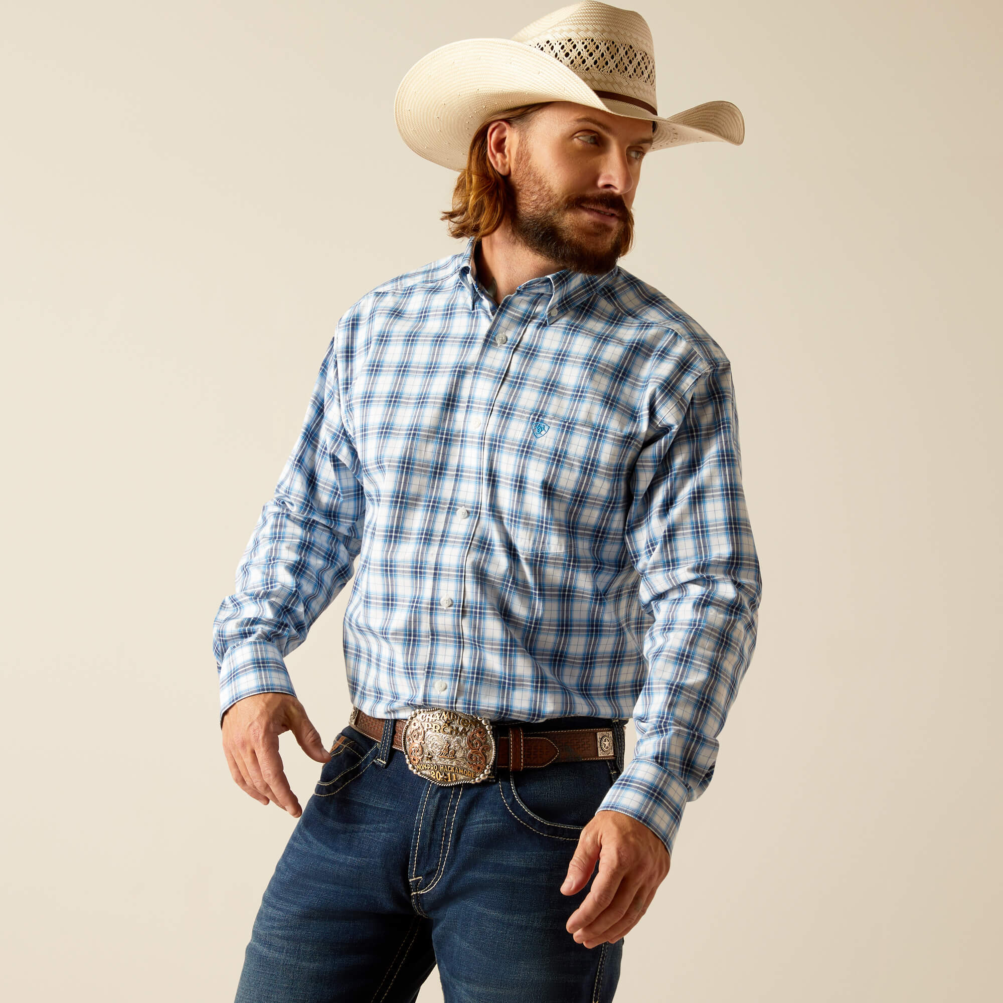 Men's Ariat long sleeve shirt in Blue Plaid. Front view showing shirt tucked in. 
