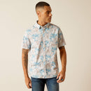 Men's Ariat short sleeve shirt in Moonbeam featuring a tropical floral pattern. This shirt is a modern fit and can be worn untucked. Front view showing shirt untucked. 
