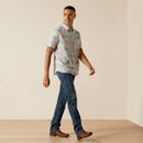 Men's Ariat short sleeve shirt in Moonbeam featuring a tropical floral cow skull pattern. This shirt is a modern fit and can be worn untucked. Full front view