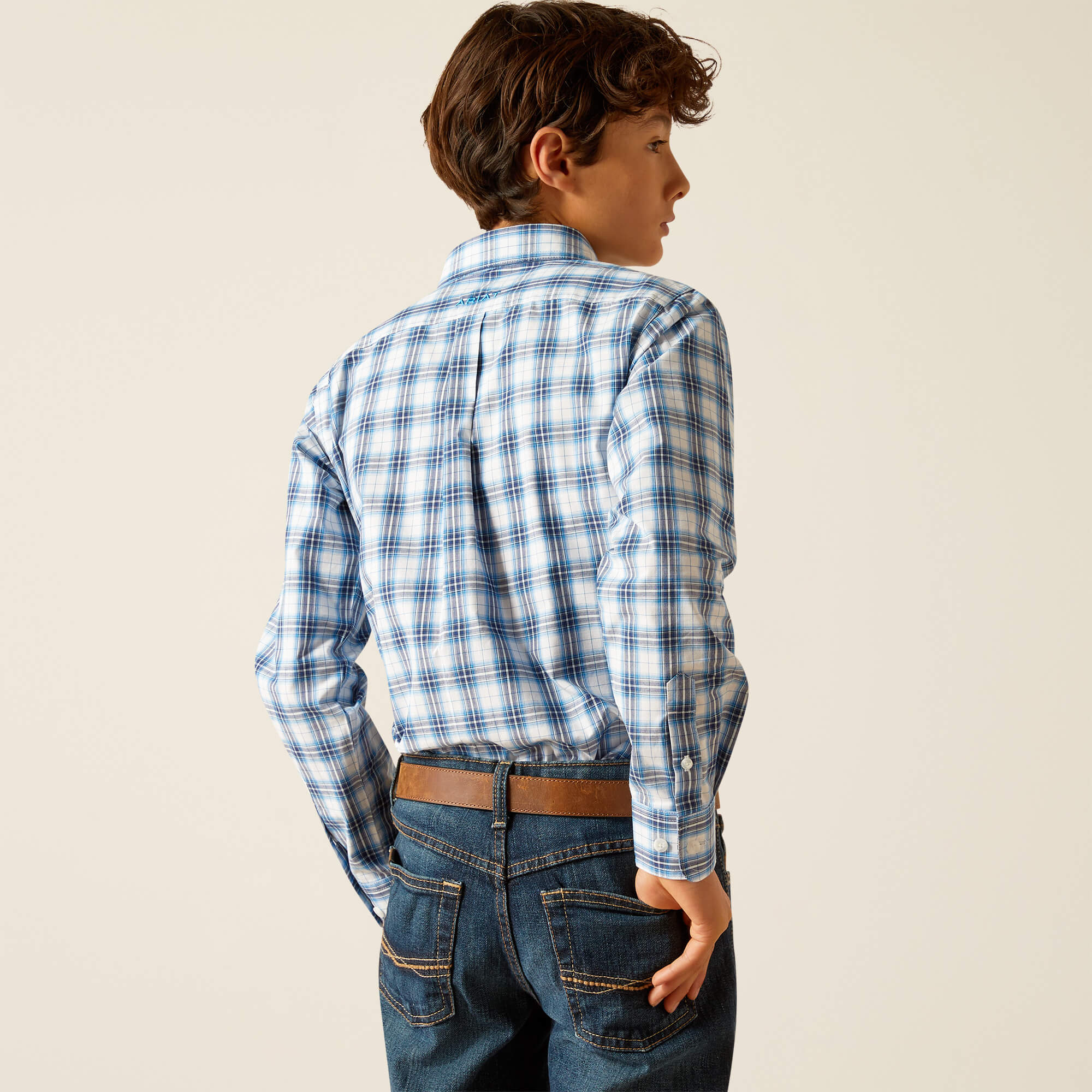 Boy's Ariat long sleeve Pro Series shirt in Blue Plaid. Rear view showing shirt tucked in.