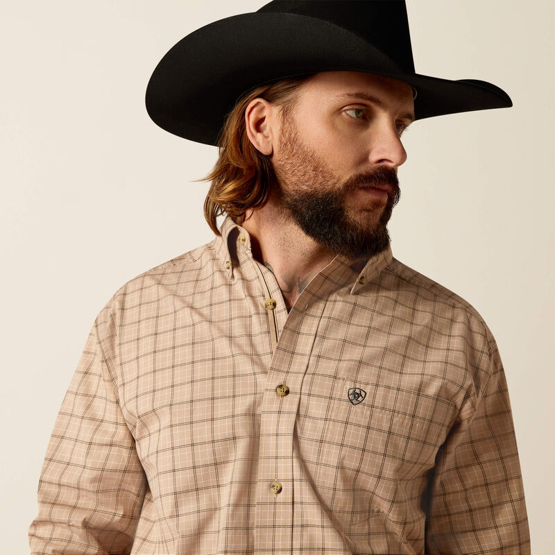 Men's Ariat Pro series long sleeve shirt in Khaki Plaid. Close up of button down collar and Ariat shield logo on left chest pocket. 
