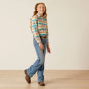 Girl's Ariat blue and brown Serape Print long sleeve Team logo shirt. Full front view showing shirt tucked in. 