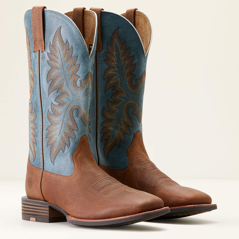 Mens Brown Ariat square toe cowboy boots with blue shaft and colorful outsole. Side view of both boots. 