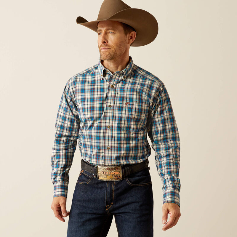 Men's Ariat long sleeve shirt in Teal Plaid. Front view showing shirt tucked in. 