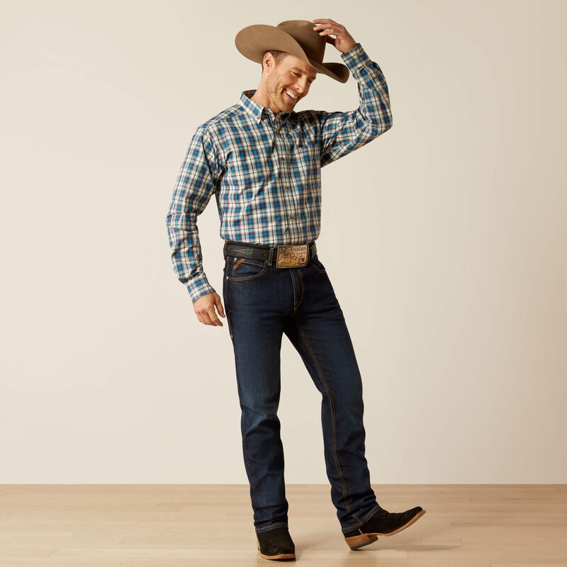 Men's Ariat long sleeve shirt in Teal Plaid. Full front view showing shirt tucked in. 