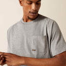 Men's Ariat Rebar short sleeve graphic tee in Heather Grey. Front view close up of left pocket featuring Ariat Rebar logo. 