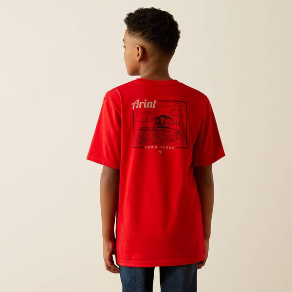 Boy's Ariat short sleeve tee in Redline. Back view showing untucked red tee with a Ariat logo and farming graphic. 