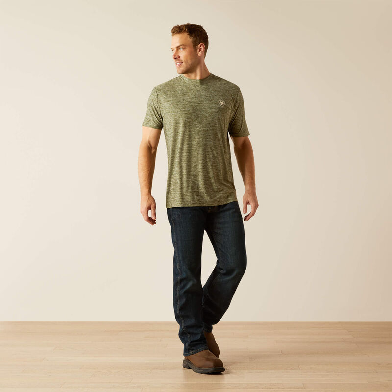 Men's Ariat short sleeve tee in Dark Olive. Dark Olive is a heathered green. Full front view showing shirt untucked. 