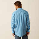 Men's Ariat long sleeve wrinkle free shirt in Blue. Rear view showing shirt untucked and Ariat logo over vent. 