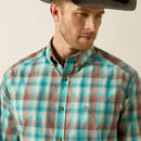 Men's Ariat classic fit button up Western style long sleeve shirt in Aqua Blue Plaid. Close up front view showing hidden pen slot in left pocket featuring a stitched Ariat logo. 