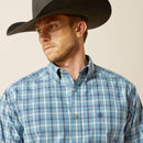 Men's Ariat long sleeve button up shirt in Blue Plaid. Front close up showing stitched Ariat logo on chest pocket. 