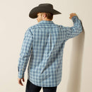 Men's Ariat long sleeve button up shirt in Blue Plaid. Rear view shirt untucked. 
