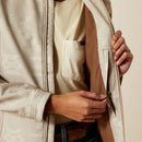 Women's Ariat softshell logo jacket in Tan Southwest Cross Stitch. This jacket features a bold Ariat logo on left sleeve. Showing inside zippered pocket. 