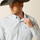 Men's Ariat long sleeve button up classic fit Western style shirt in White Plaid. Close up of front showing contrast trim on collar and stitched Ariat logo on front pocket. 