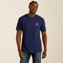 Men's Ariat logo short sleeve tee in Medieval Blue. Model is wearing the shirt untucked and shows the Ariat logo on front chest. 