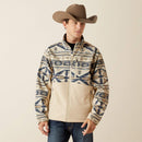 Men's Ariat Softshell jacket in White Pepper Southwest. This jacket has a solid beige bottom and a Southwestern pattern on the top made of blue and browns. It has a zippered close and a bold Ariat logo on left sleeve. 