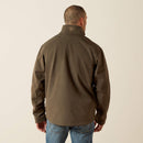Ariat men's softshell jacket in Earth Green Heather. This jacket features a bold Ariat logo on the left sleeve in brown. Back view showing the Ariat shield logo on back collar. 