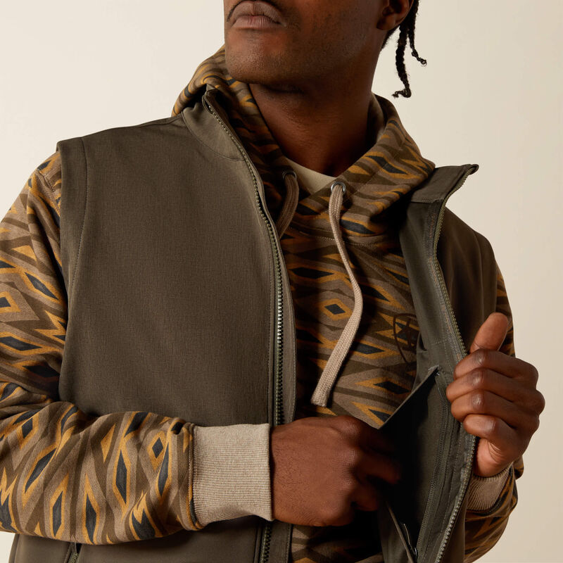 Men's Ariat dark green heather vest front closeup showing front zipper, zippered left chest inside pocket.