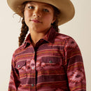 Girl's Ariat long sleeve shirt in Rosa Southwestern, shirt has pearl snaps and a Southwestern style pattern in burgundy and red tones. Front view showing chest pockets with snap closures.
