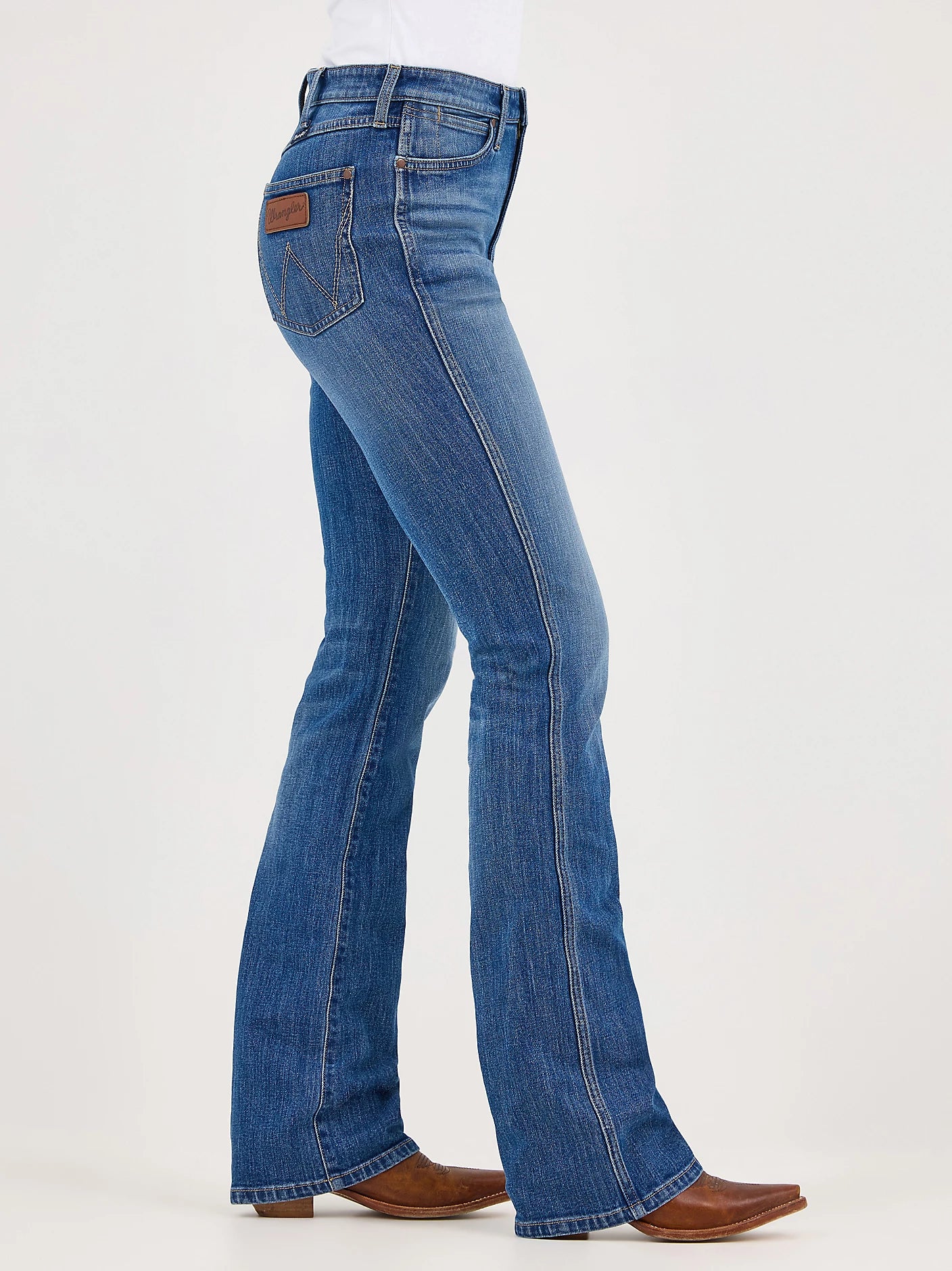 Women's Bailey Retro bootcut jeans in Josephine blue wash full right side view. Shows front coin and scoop pockets, and back patch pocket. All have rivets at the top corners.