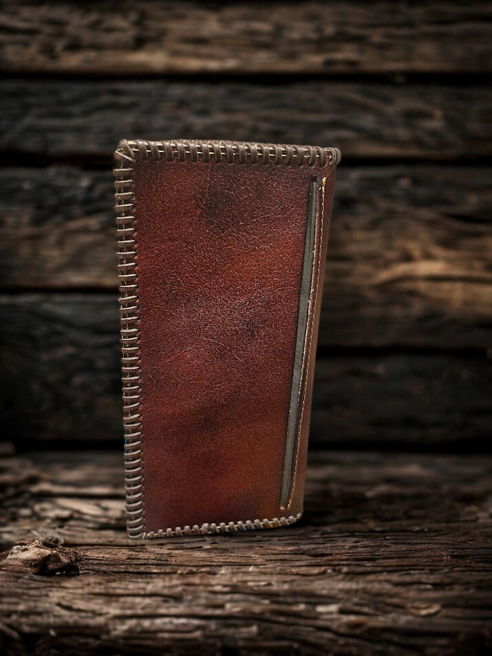 Brown leather tall wallet with whipstitch border and a embossed Praying Cowboy design. Rear view showing additional cash slot. 