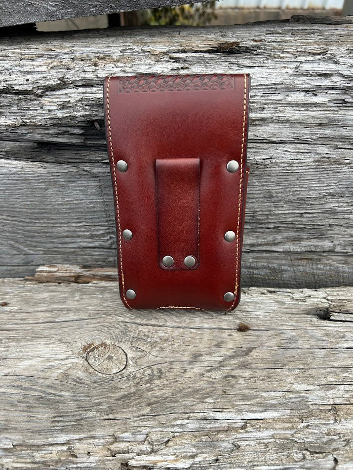 Brown embossed leather phone case with a Bull Rider Concho, has leather belt loop attachment. Rear view showing belt loop attachment that measures 3 1/4 inches high.