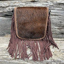 This cowhide and fringe crossbody bag in Coffee Brown leather has a removable and adjustable strap. Front View A