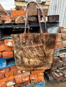 Brown leather and cowhide tote bag. Front View A