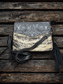 This Black tooled leather and cowhide purse features a removable adjustable shoulder strap and zippered close concealed carry pocket on the rear. Front View C