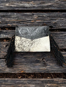 This Black tooled leather and cowhide purse features a removable adjustable shoulder strap and zippered close concealed carry pocket on the rear. Front View G