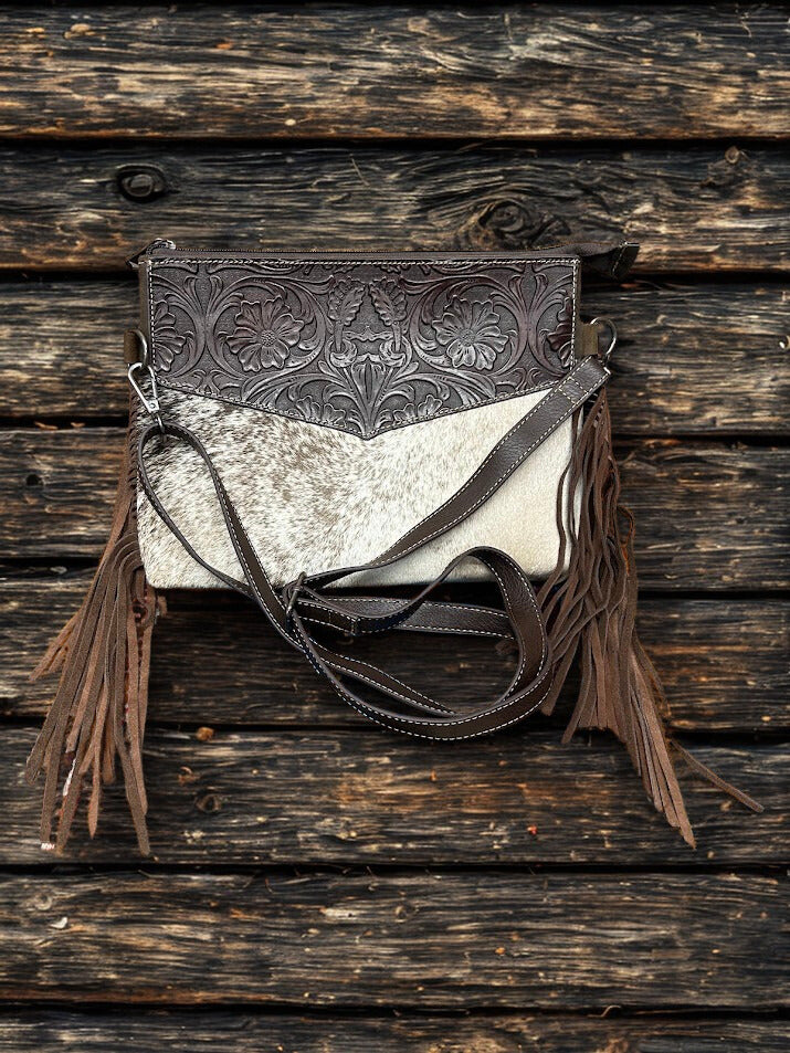 This Coffee Brown tooled leather and cowhide purse features a removable adjustable shoulder strap and a zippered closed concealed carry pocket on the rear. Inside it has six card slots and a zippered closed pocket. Front View A