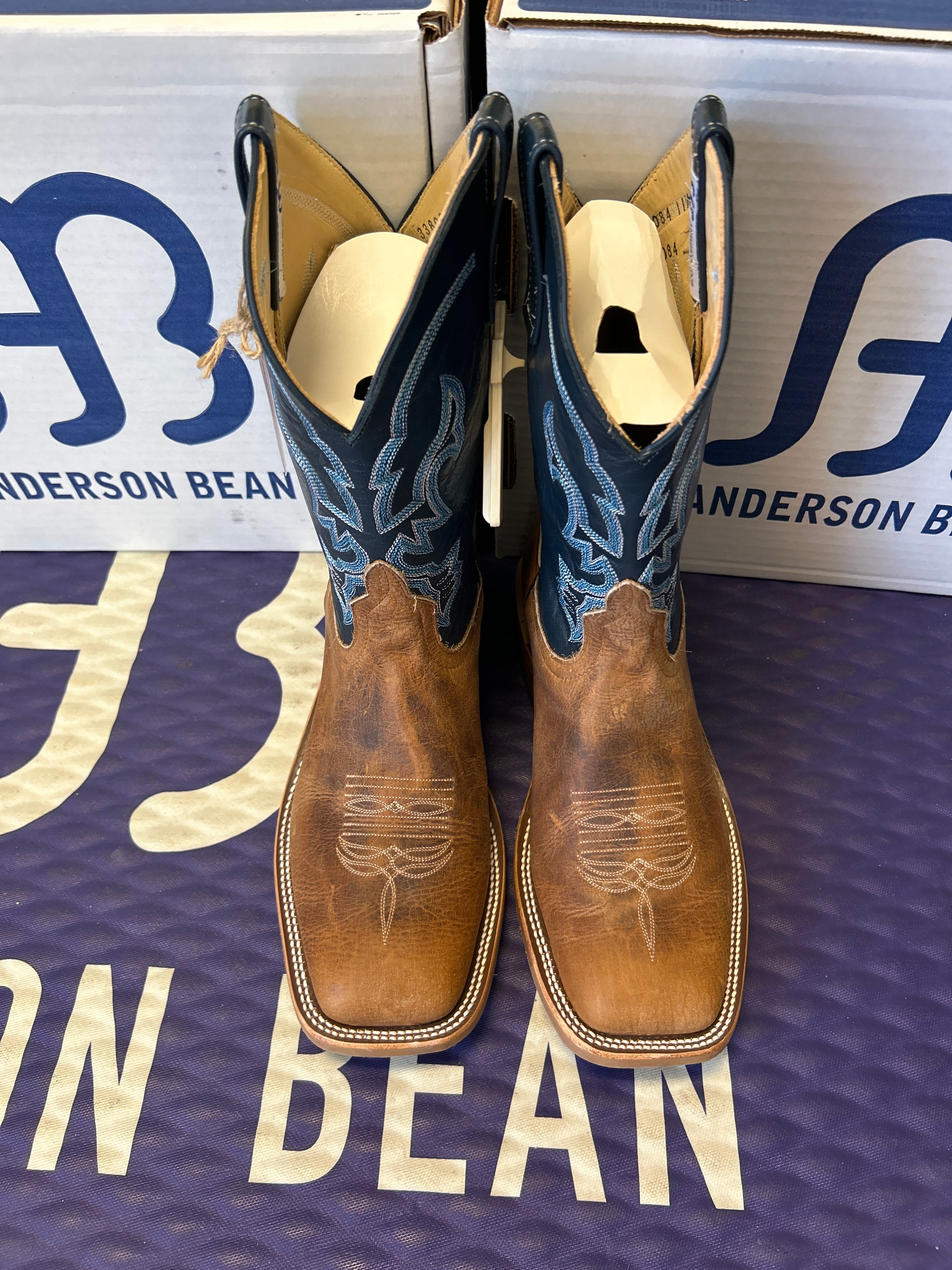 Pair of cowboy boots on a Anderson Bean branded box